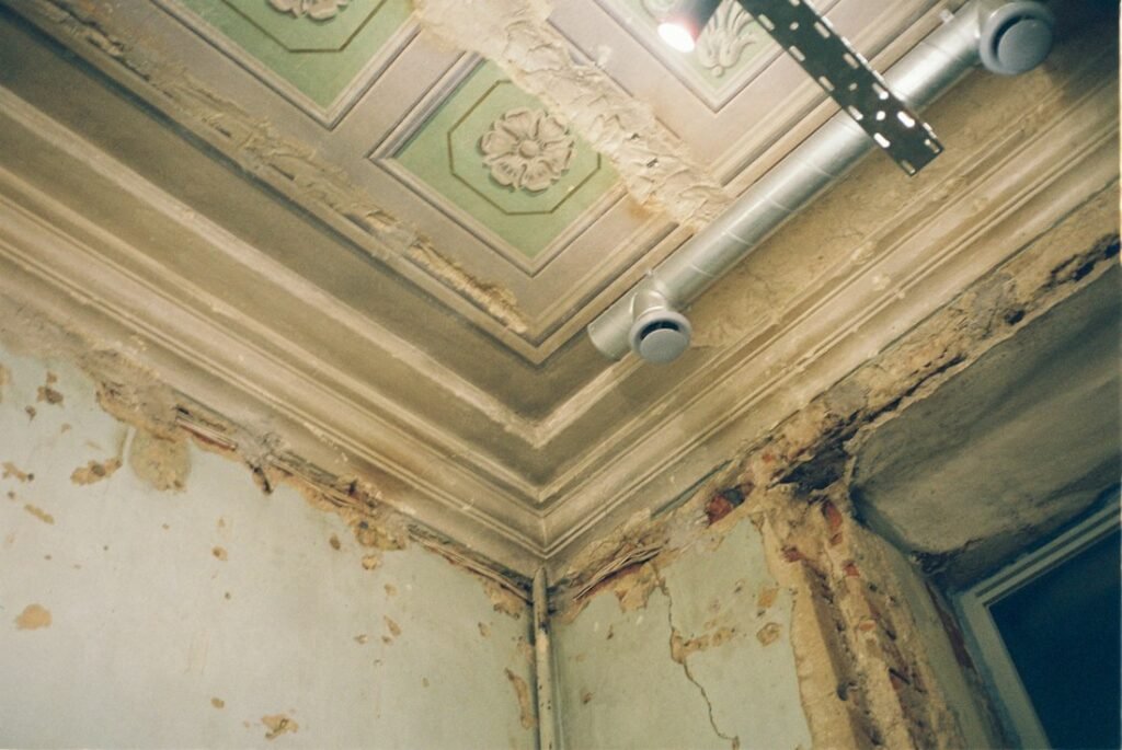 Ceiling water stain and peeling paint from an untreated water leak, the kind of damage this crew responds to in Cape Coral, FL