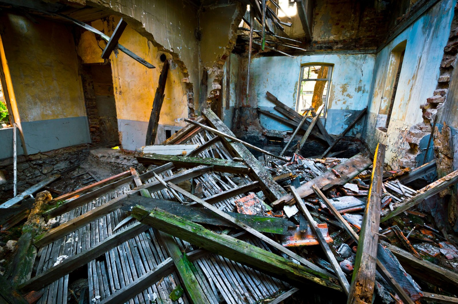 Interior of a fire damaged structure with debris, the kind of scene a restoration crew secures and rebuilds